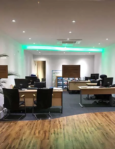 Open-plan office with feature lighting, designed and built by Sapphire