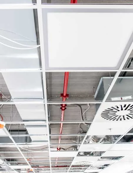 Suspended ceiling grid installation with services above