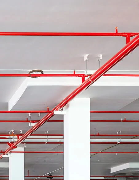 New fire sprinkler pipework installed across a commercial ceiling