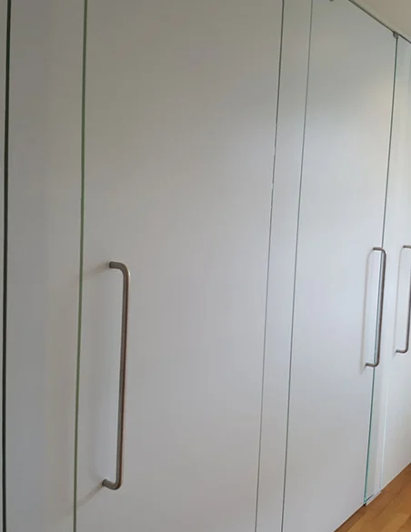Fitted storage wall with full-height doors